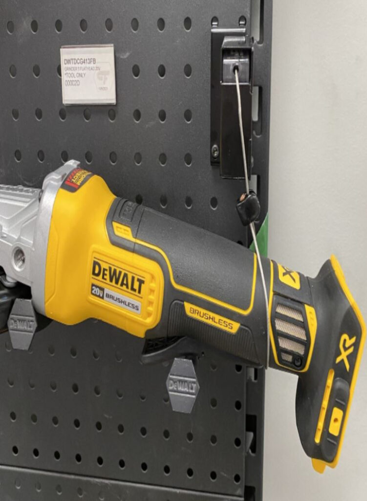 Electric powered grinder secured to a retail display with product from RTF Global