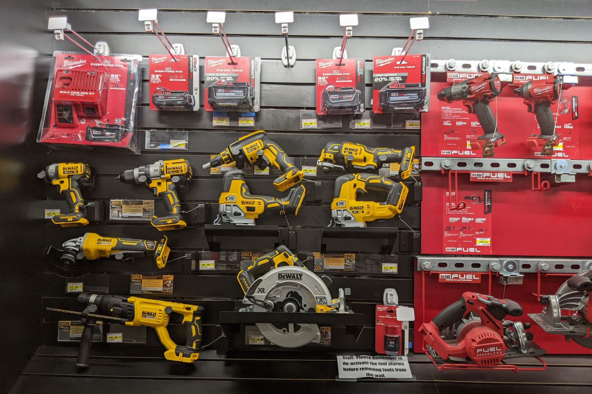 Power tools secured to a retail display in a hardware store by products from RTF Global