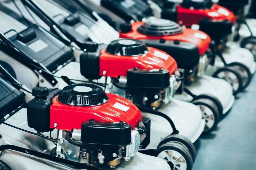 Lawnmower secured to a retail display using recoilers from RTF Global