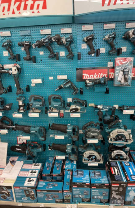 Power tools being secured to a retail display with recoilers from RTF Global