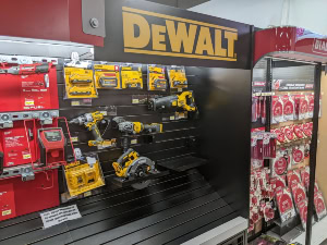 Dewalt power tools secured to a retail display